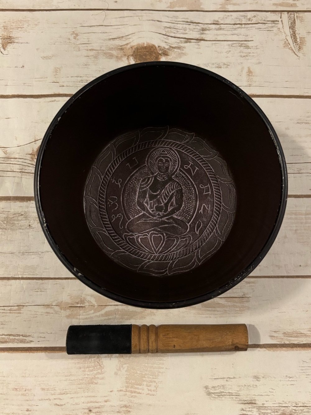 Tibetan Singing Bowl Featuring An Embossed Figure Of Buddha